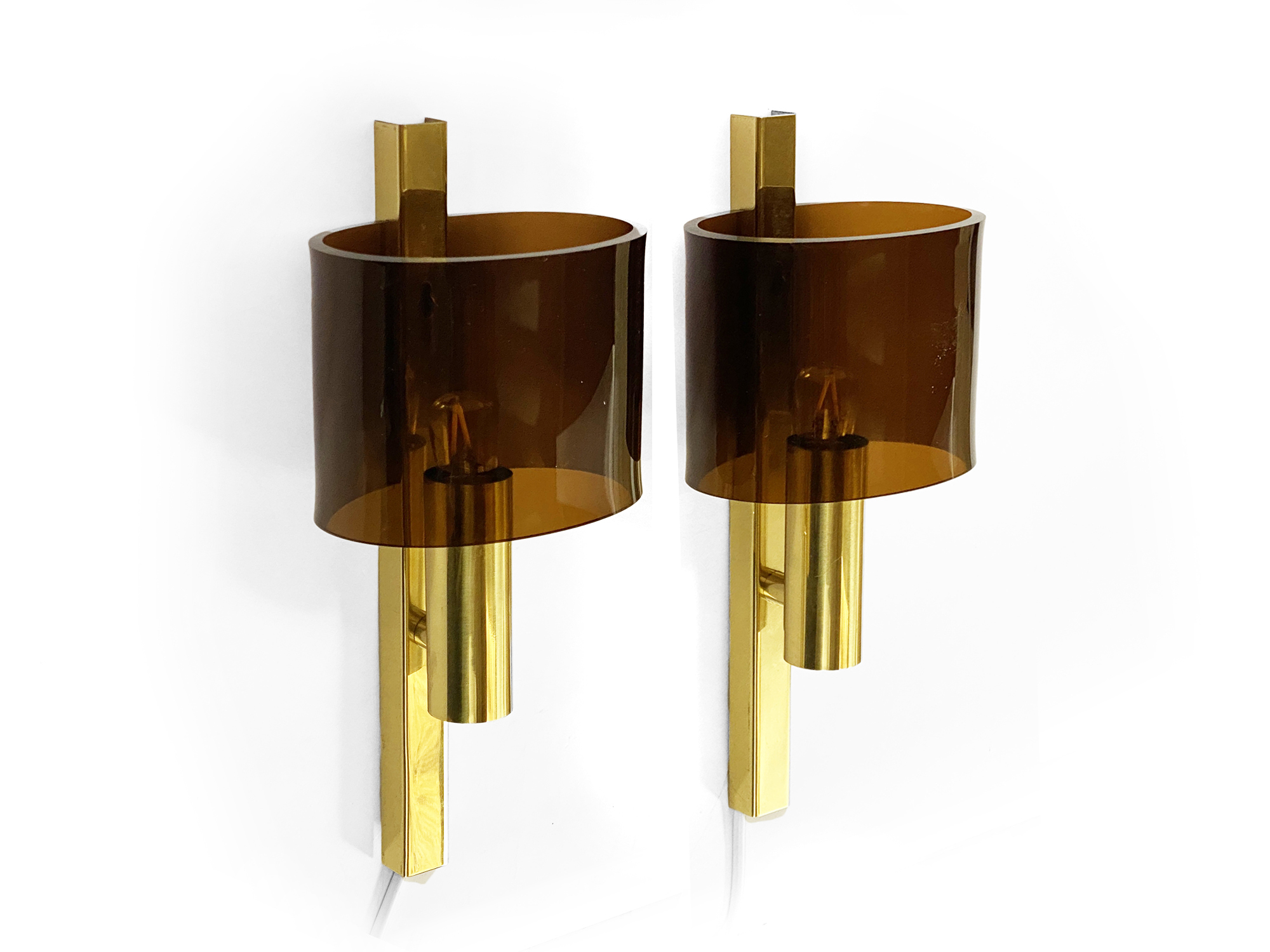 Pair of brass sconces with toned plastic shades. Denmark 1970s
